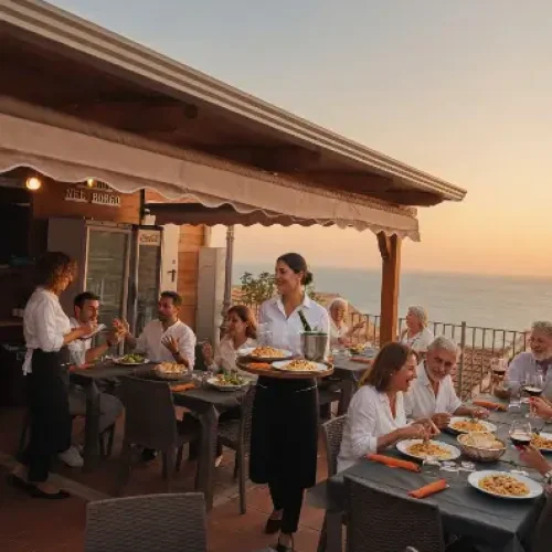 Terrazza panoramica di un ristorante sul mare al tramonto con 9 clienti seduti ai tavoli e 2 cameriere che servono piatti. Atmosfera calda e conviviale con vista mozzafiato sul mare.